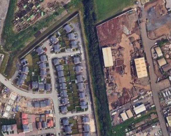 Aerial photo of the recycling facility alongside a new housing estate, Doncaster